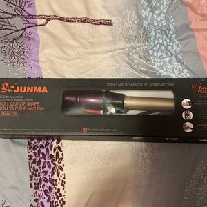 Self rotating curling iron